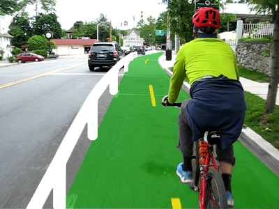 Rendering of a protected bike lane drawn on top of a street scene where someone is cycling.