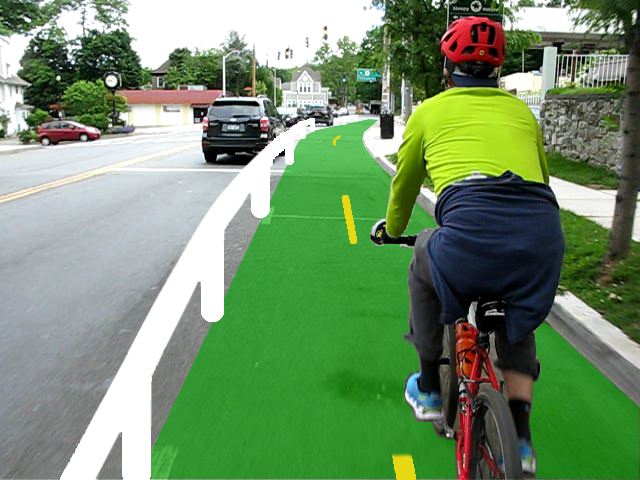 Photo of Broadway looking north toward Beekman Ave with someone cycling away from us. A rendering of a guardrail protected bicycle lane is superimposed upon the parking lane.