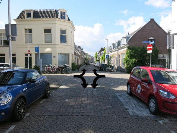 Photo of two one way streets head into each other then people driving must turn into either of the one way streets heading away from the intersection.