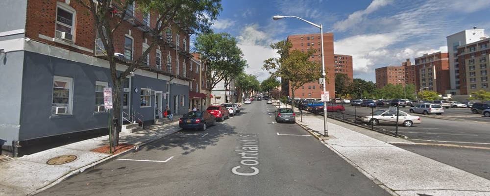 Screen capture of Google StreetView of Cortland St north of Wildey St. Shows a giant parking lot on the right side.