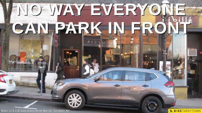 Text: No Way Everyone Can Park in Front. Photo: A car parked on in a parallel parking space in front of a storefront restaurant that is the same width as the parking spot's length.